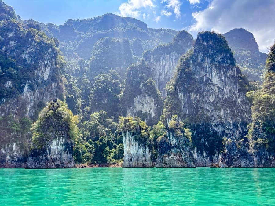 Jungle-topped karst cliffs above the emerald water of Cheow Lan Lake