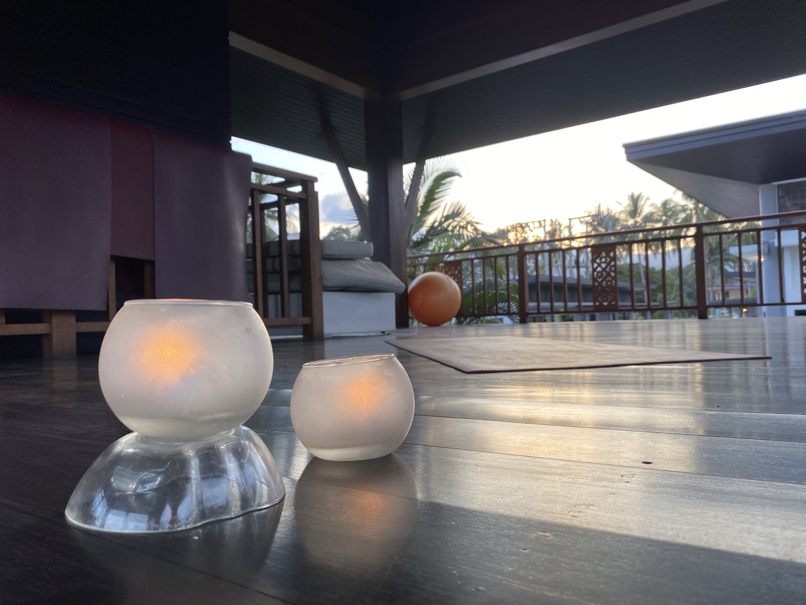 Candles and quiet light on the Aava deck at dusk
