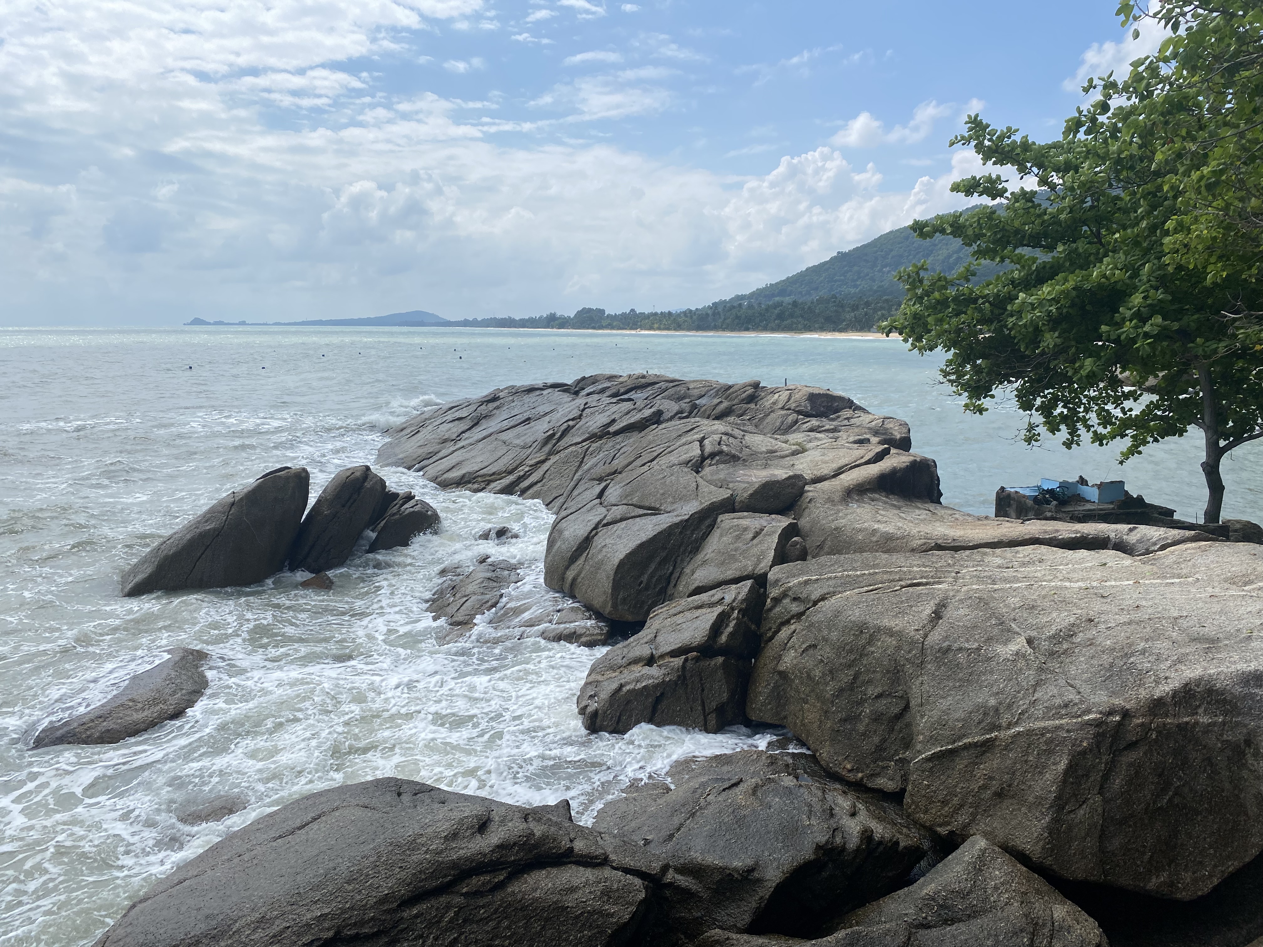 A rocky headland on Khanom's east-facing coast, early light over the Gulf