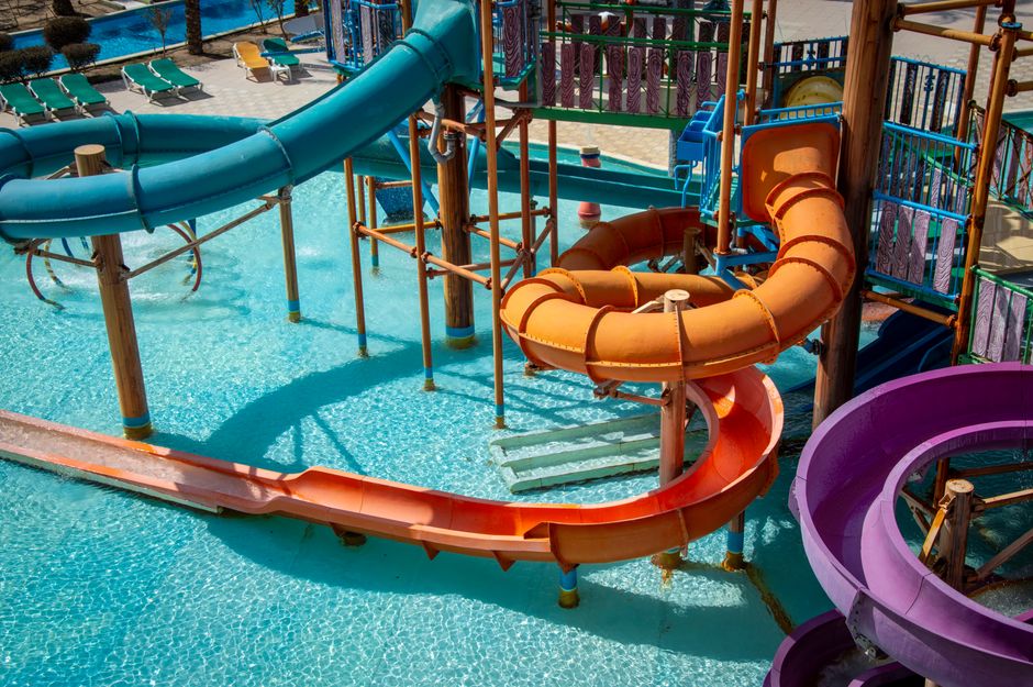 Colorful water park slides under bright sun